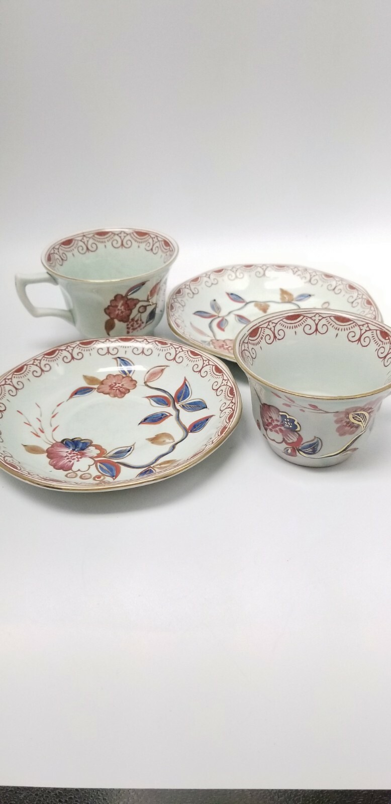Calyx Ware hand painted 2 teacup saucer set gold light green rust blue England