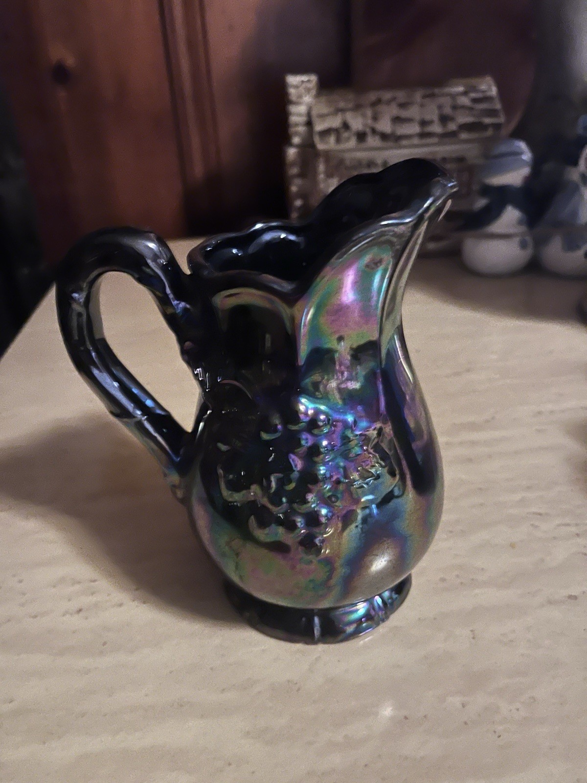 Black Iridescent Carnival Glass Ceramic Pitcher with Grape Vine Pattern