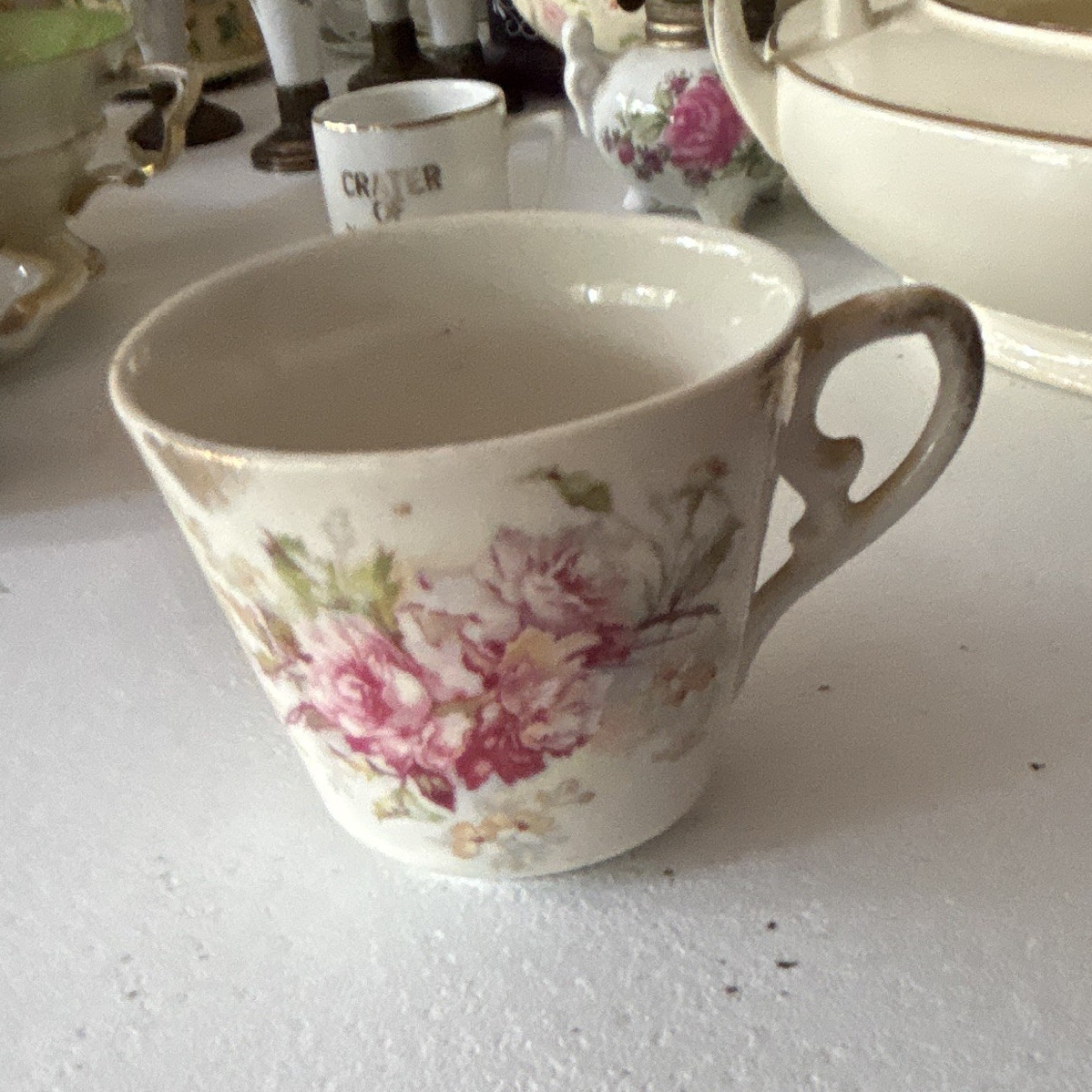 Unmarked White/Pink/Green Floral Ceramic Teacup, Scroll Handle
