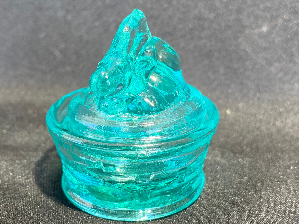 Green Vaseline uranium glass bunny rabbit on nest basket Easter glows teal blue