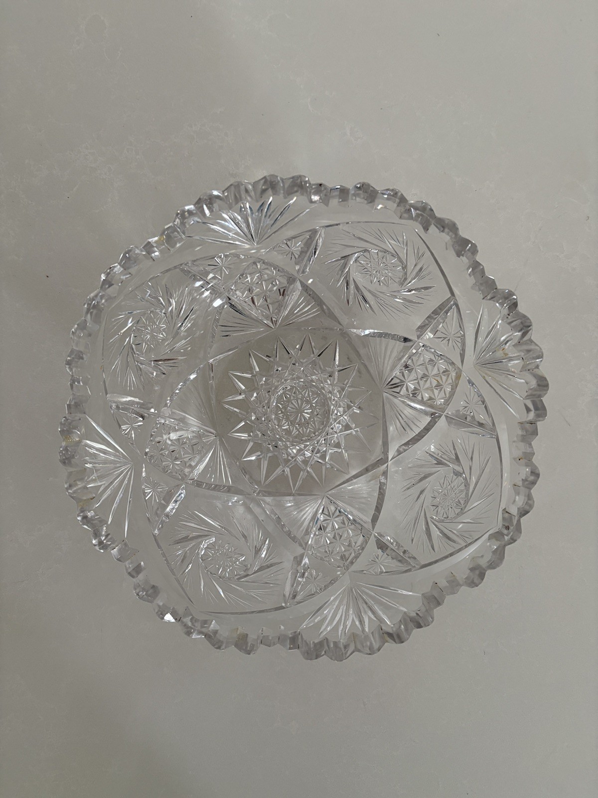Vintage American Brilliant Cut Glass Bowl in star design w/ sawtooth edge.