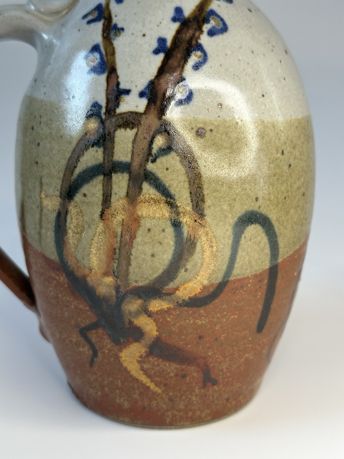 Signed AM stoneware jug, gray, tan, rust, blue, brown. Earthy Natural colors.