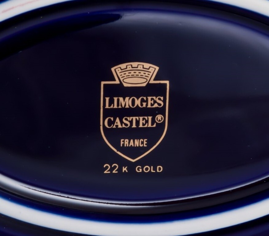 Limoges, France. Two porcelain serving platters adorned with 22-karat gold leaf