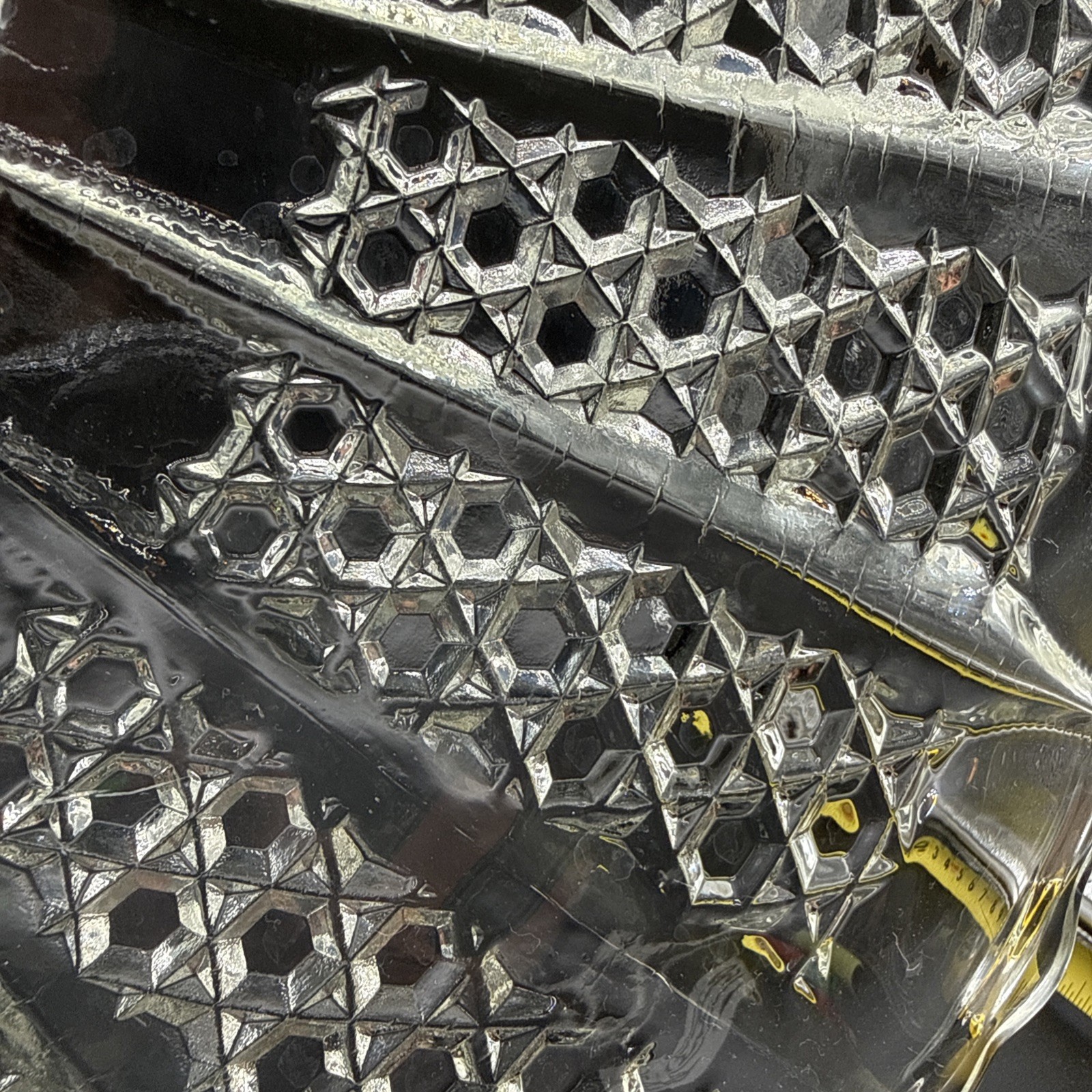 Cut crystal glass plate with radial diamond pattern