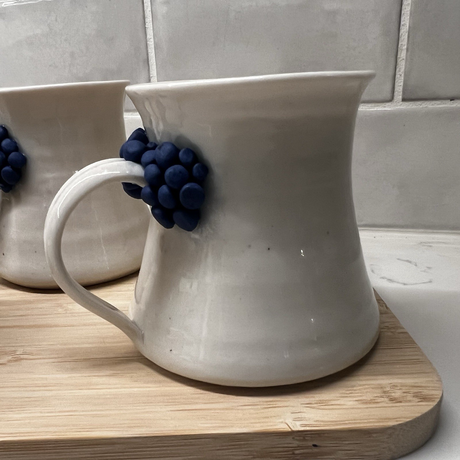 3 Handmade Pottery Mugs with blue grape design around handle, signed by artist