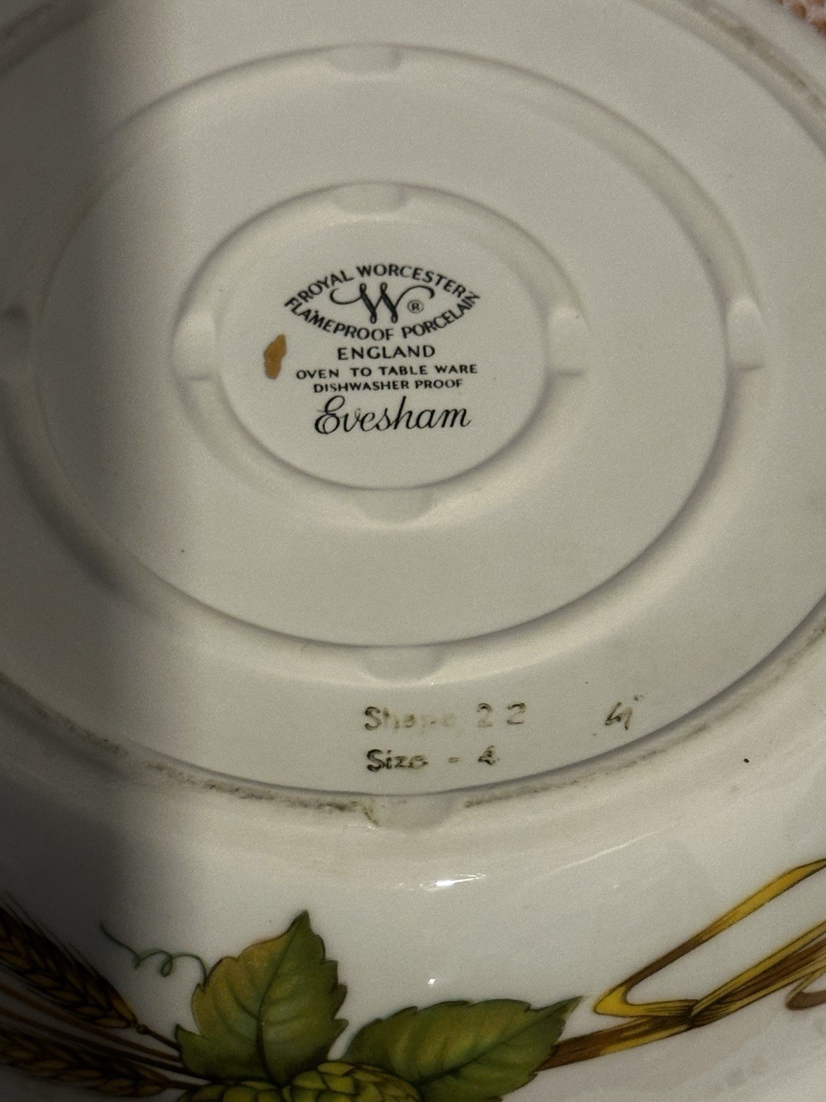 Set of three Royal Worcester Evesham Gold porcelain serving dishes with lids.