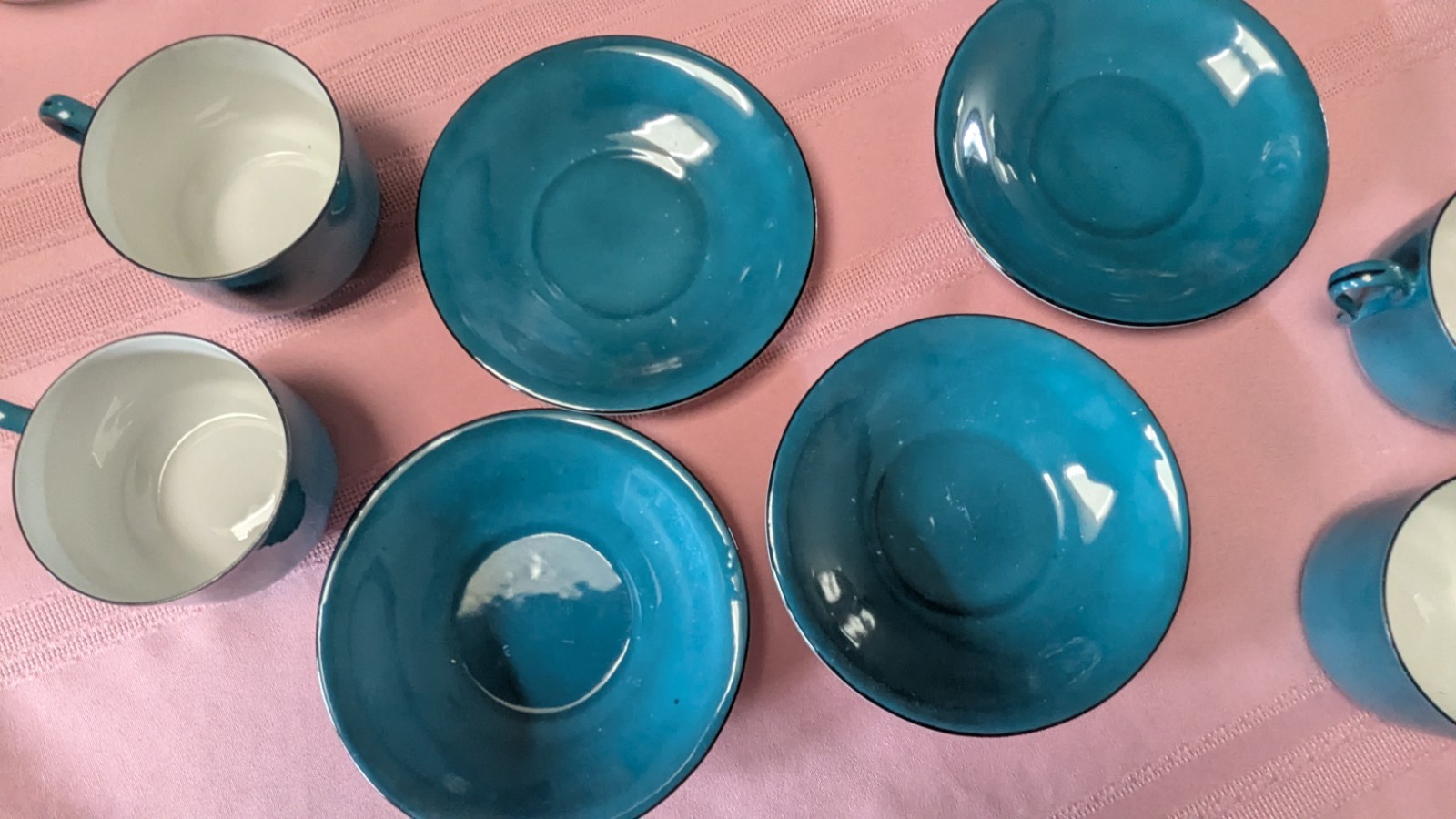 Four piece set cups saucers blue black white Germany
