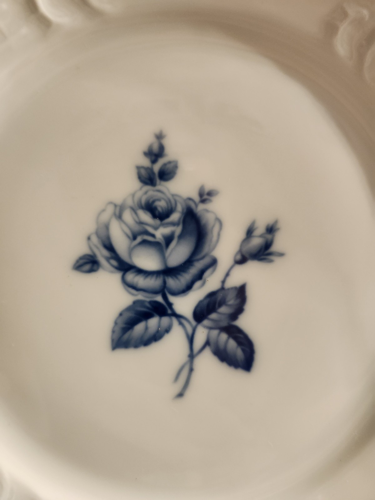 A set of 6 Rosenthal Sanssouci Blue Rose porcelain plates with embossed rims.