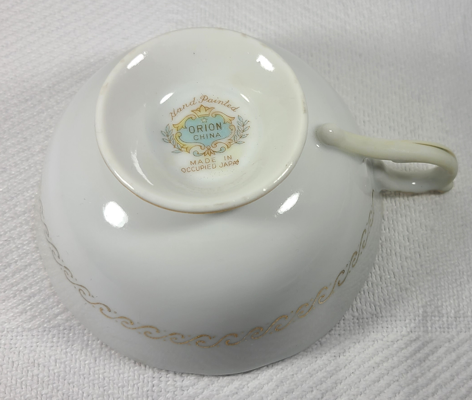 Hand Painted Orion Teacup and Saucer Made in Occupied Japan Black w/ Flowers