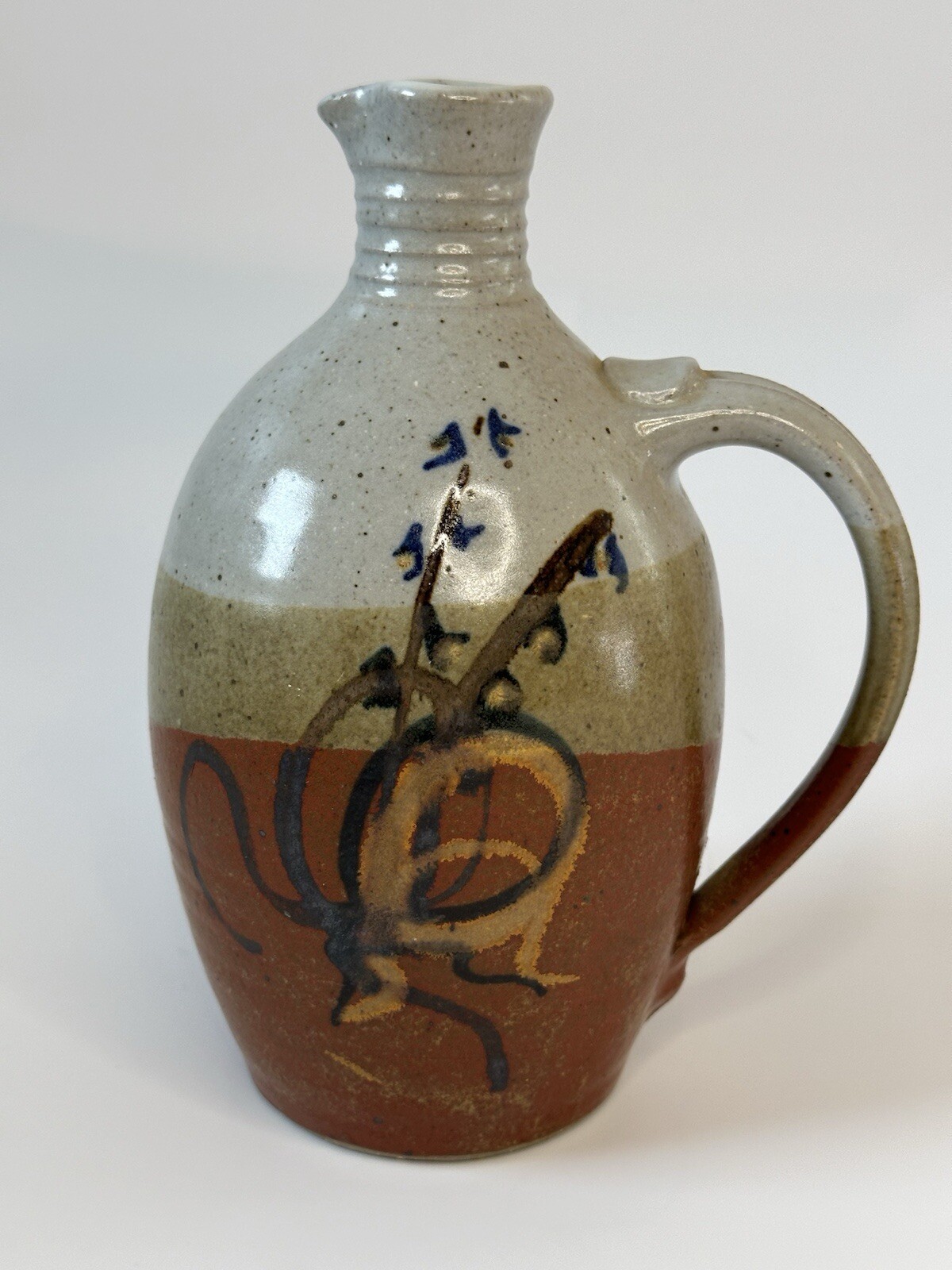 Signed AM stoneware jug, gray, tan, rust, blue, brown. Earthy Natural colors.