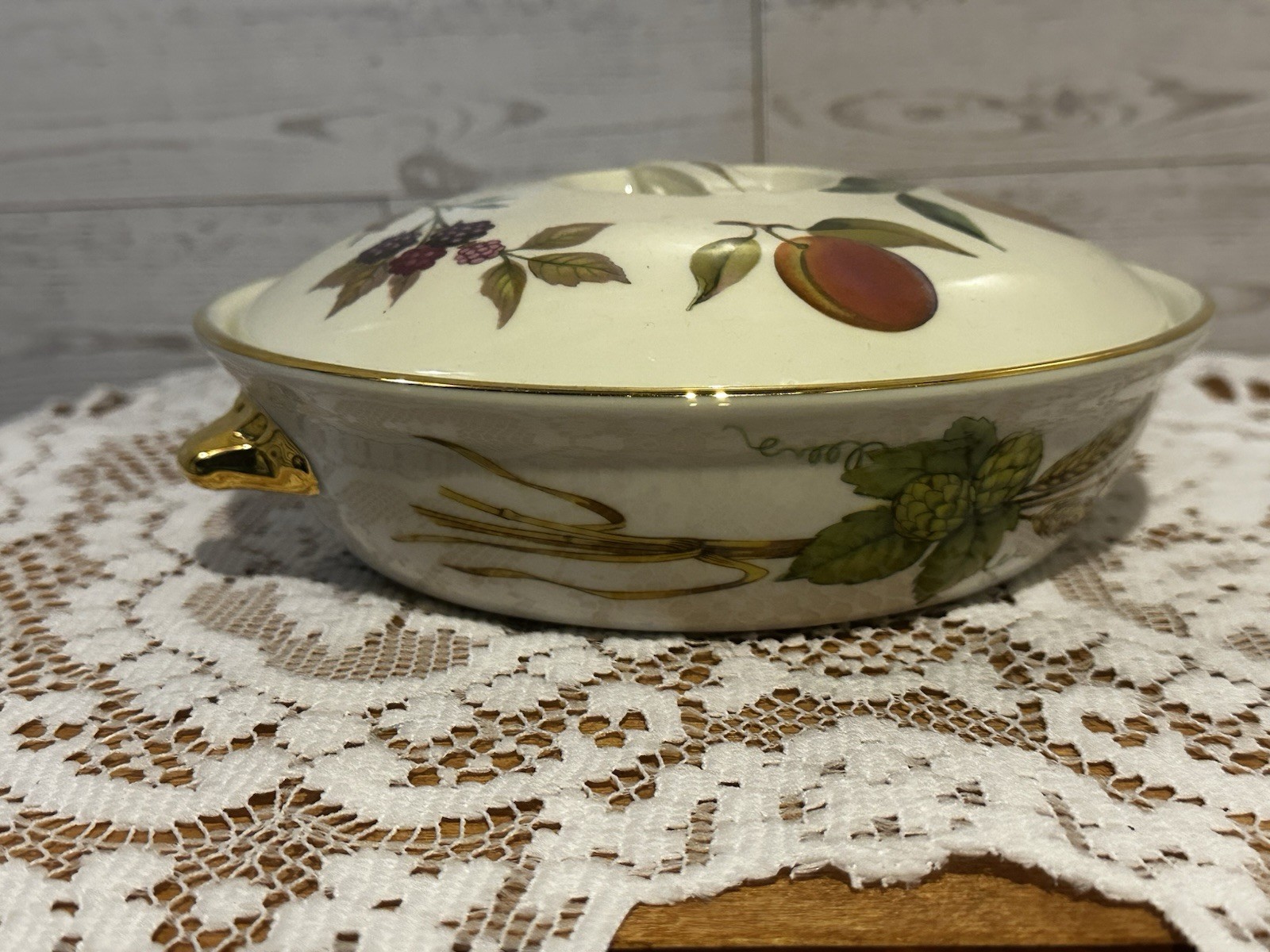 Set of three Royal Worcester Evesham Gold porcelain serving dishes with lids.