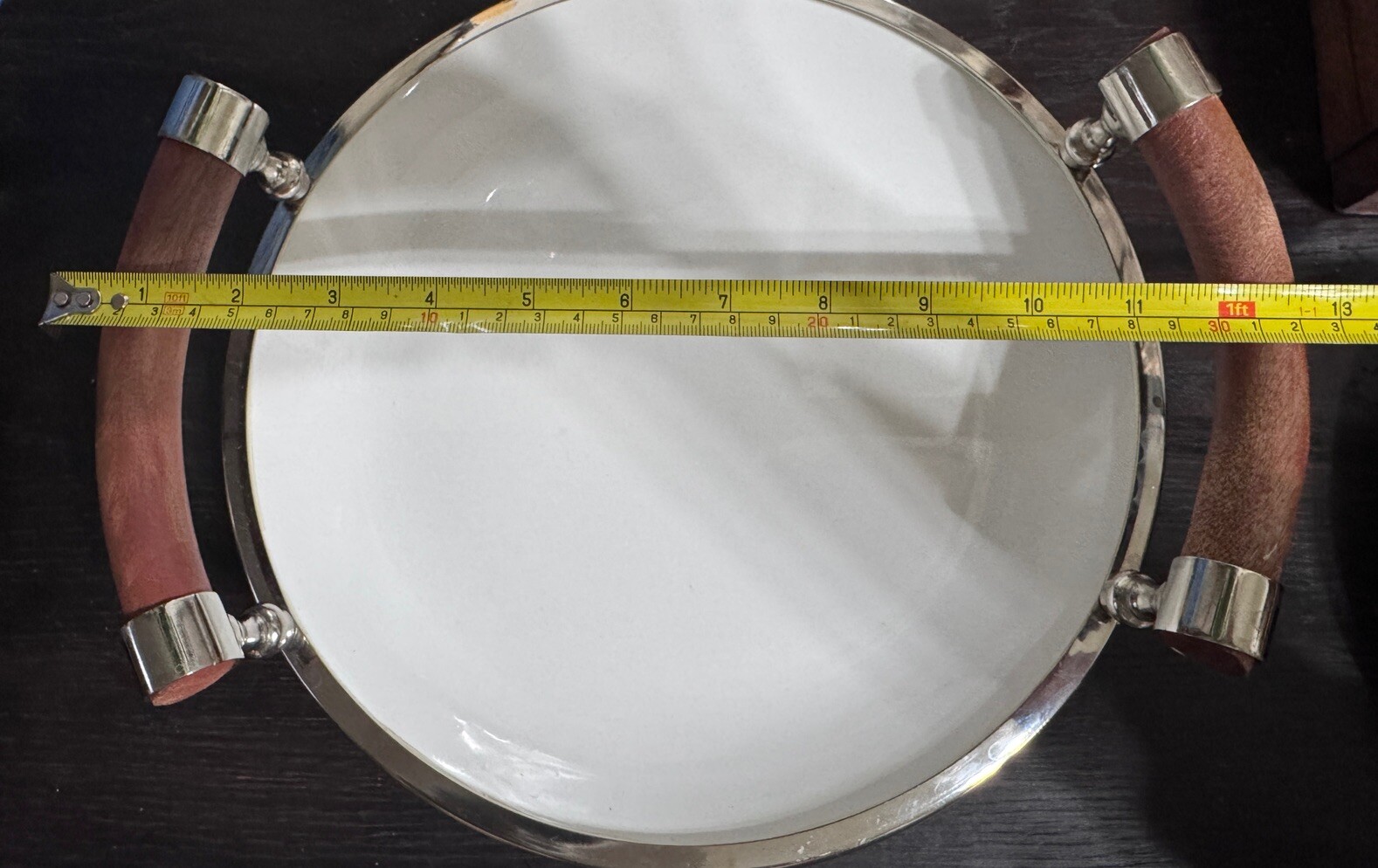 Set Of Two White Ceramic Salad Trys With Wooden Handles And Chrome Rims.