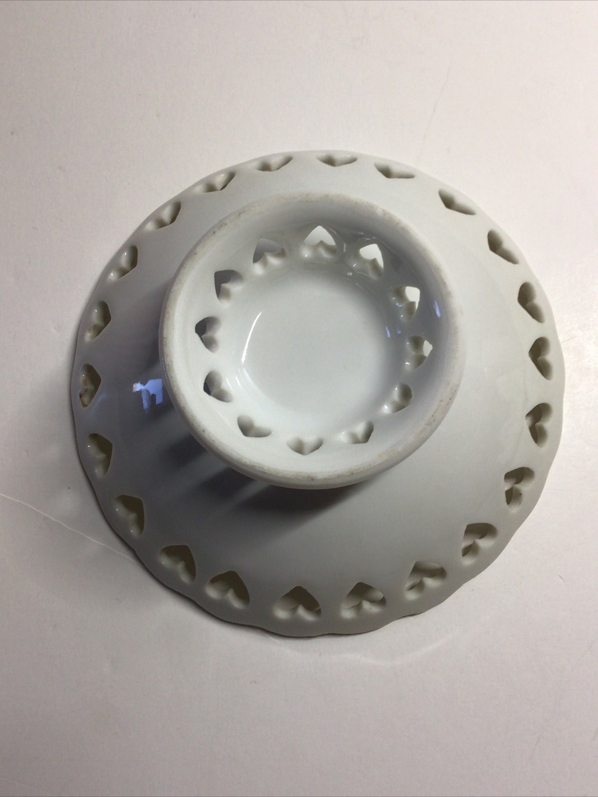 Small White Pedestal Bowl Featuring Cut Out Hearts Around the Top Edge and Base