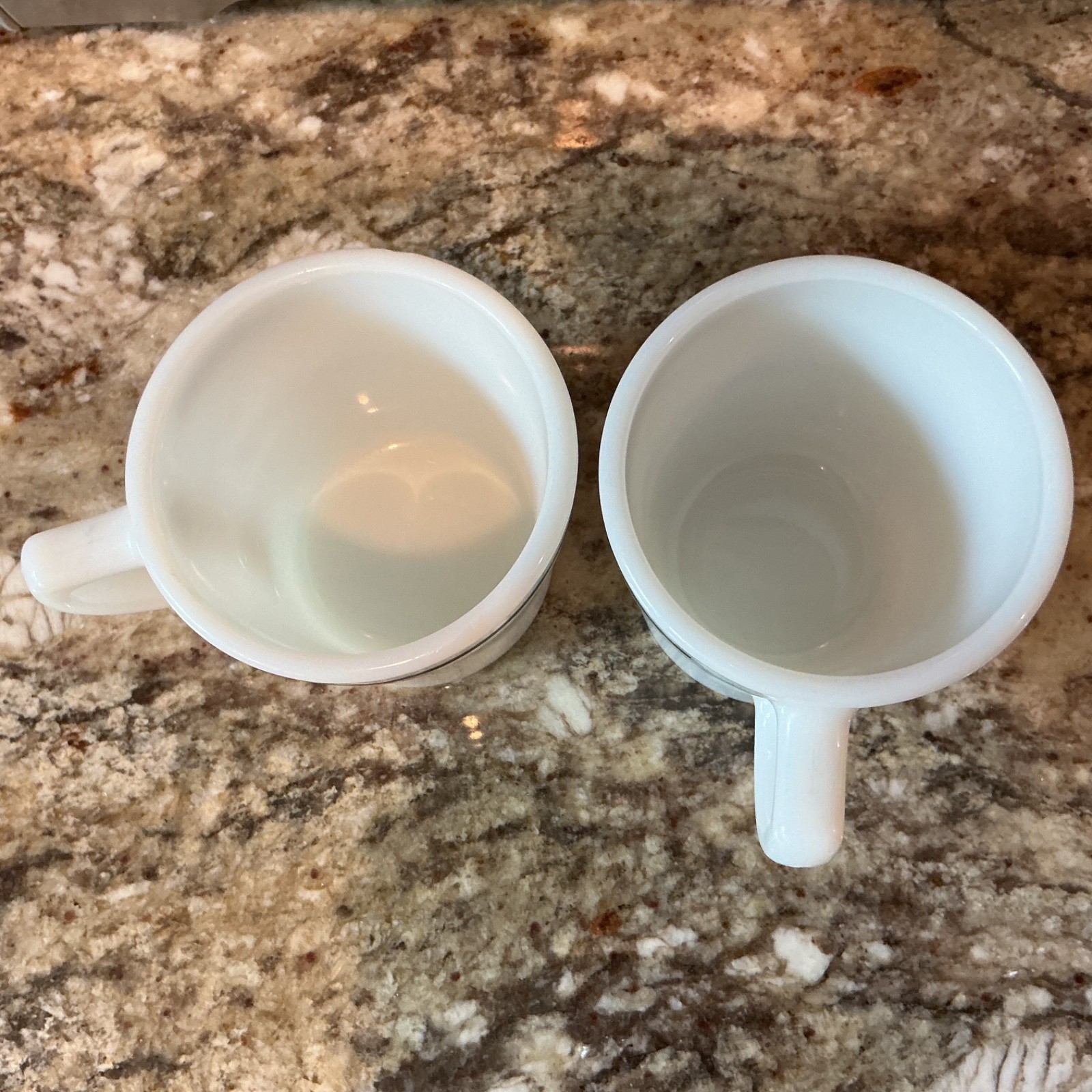 Vintage Pyrex Restaurant Ware milk glass mugs featuring dark green stripe bands