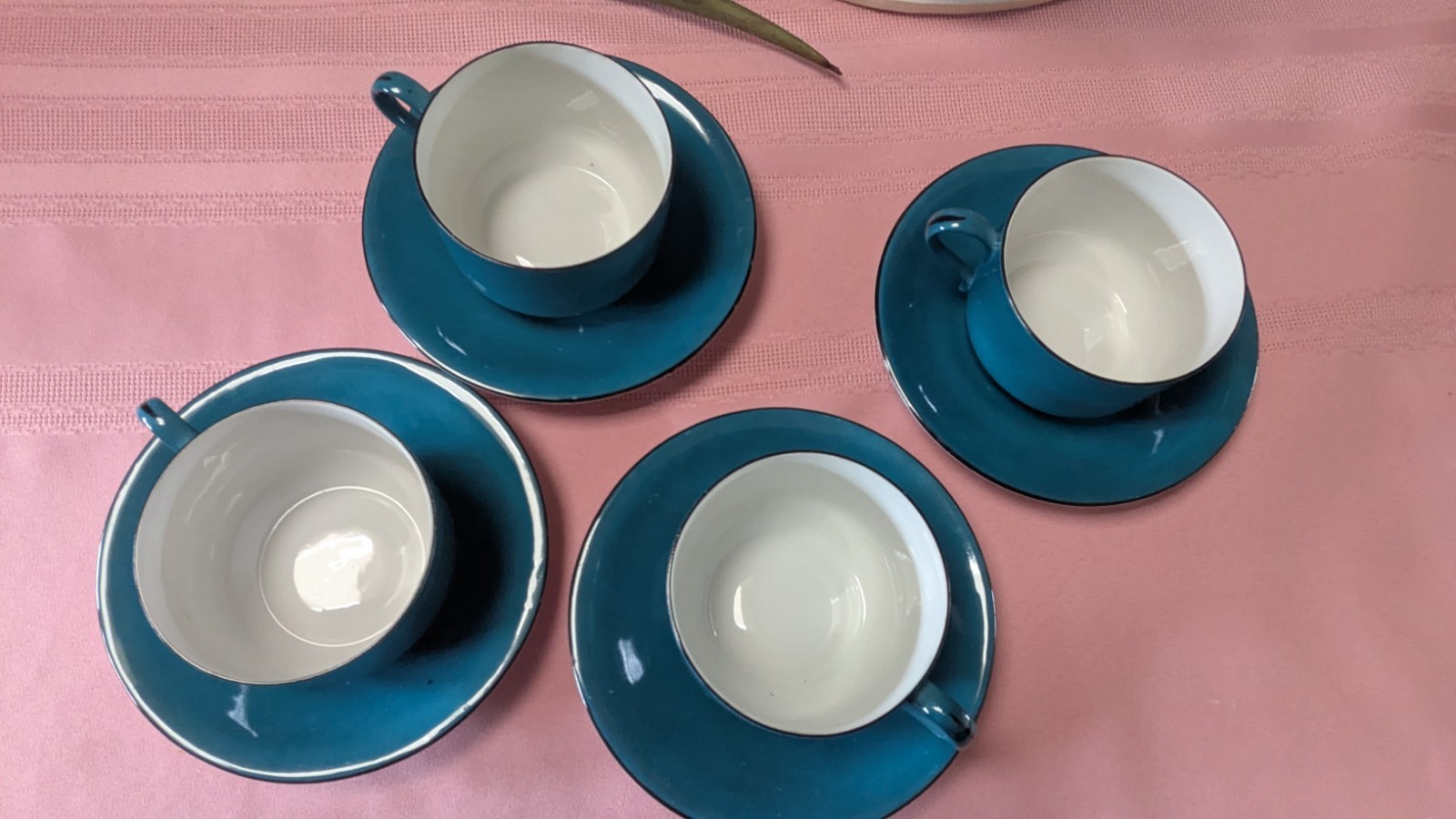 Four piece set cups saucers blue black white Germany