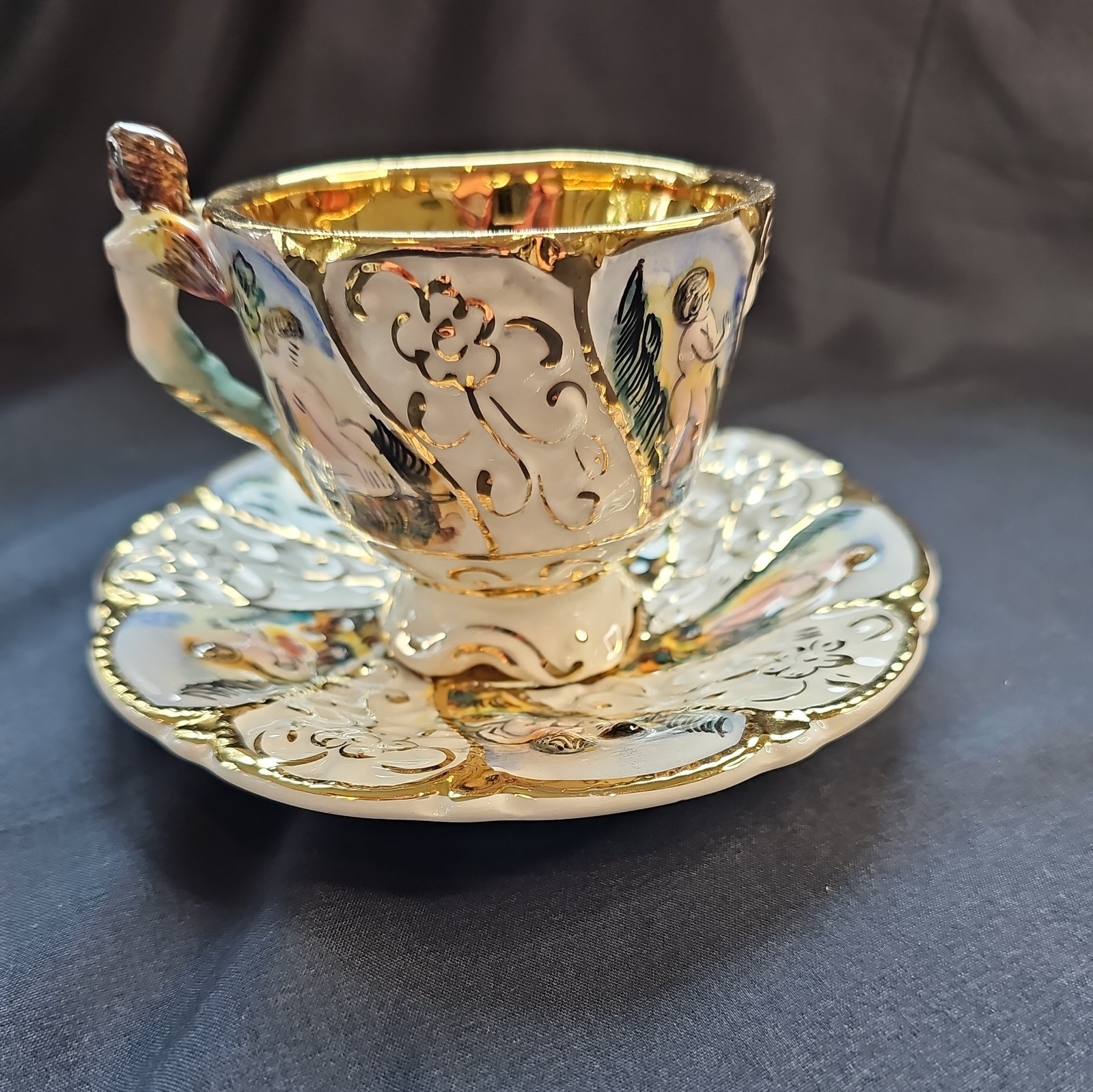 Vintage CAPODIMONTE Porcelain Hand painted Cherubs Tea Cup & Saucer, Gold Trim