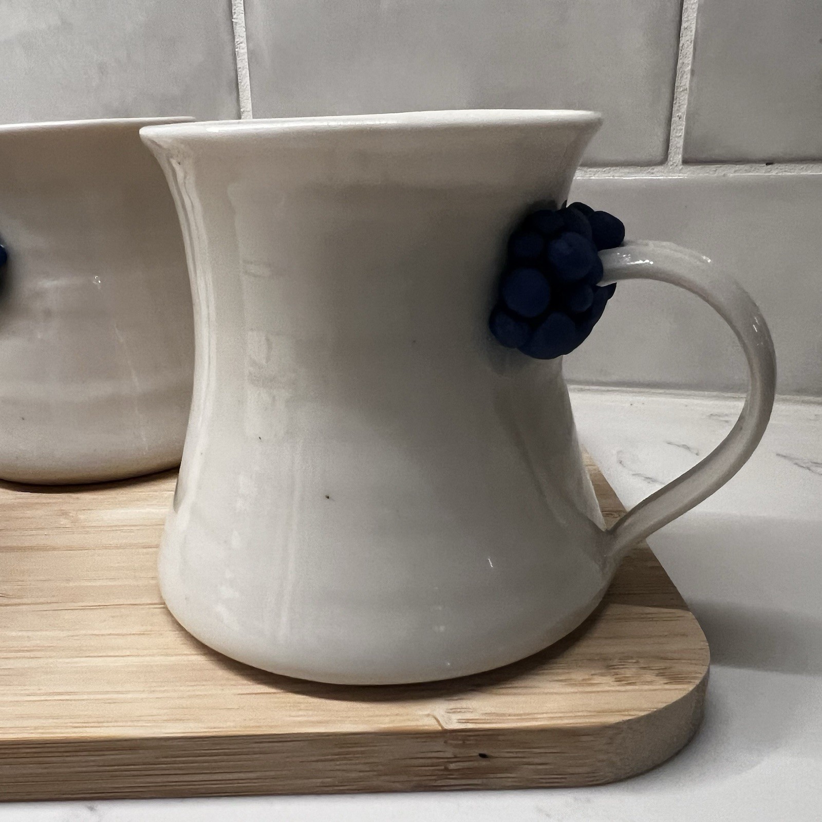 3 Handmade Pottery Mugs with blue grape design around handle, signed by artist