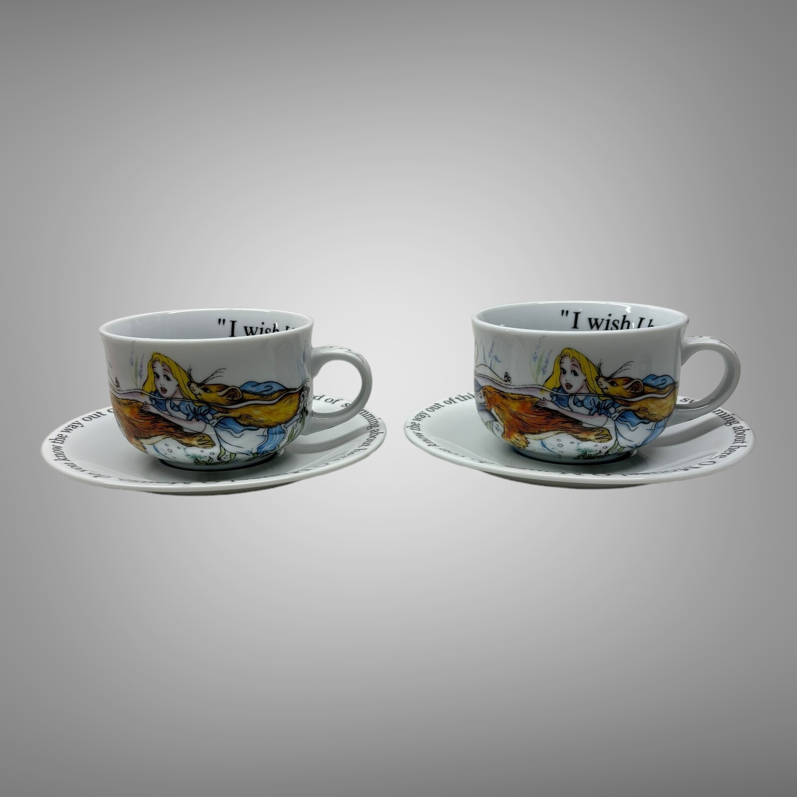 New 2010 Paul Cardew Alice in Wonderland Cafe Teacup & Saucers Set of 2 England