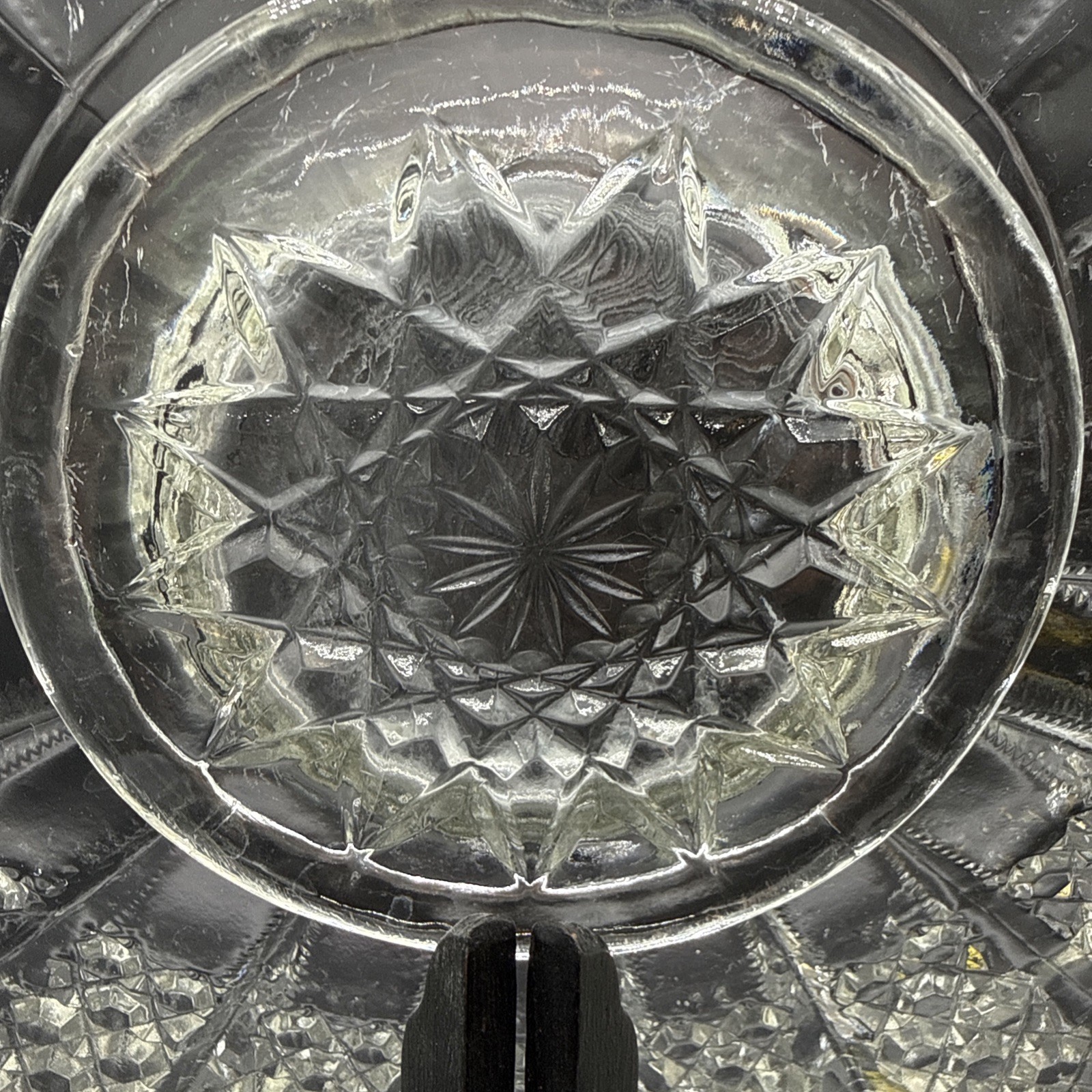 Cut crystal glass plate with radial diamond pattern