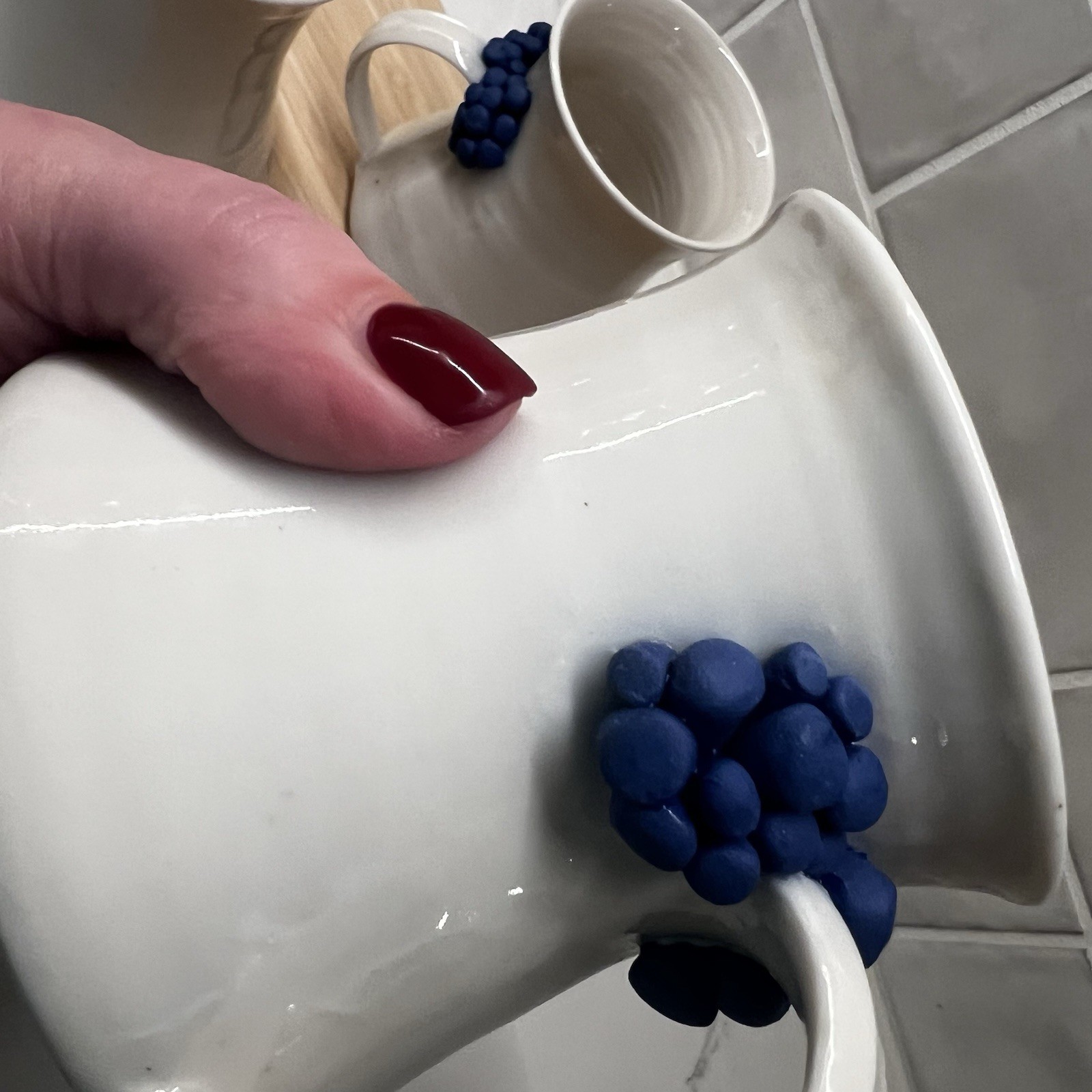 3 Handmade Pottery Mugs with blue grape design around handle, signed by artist