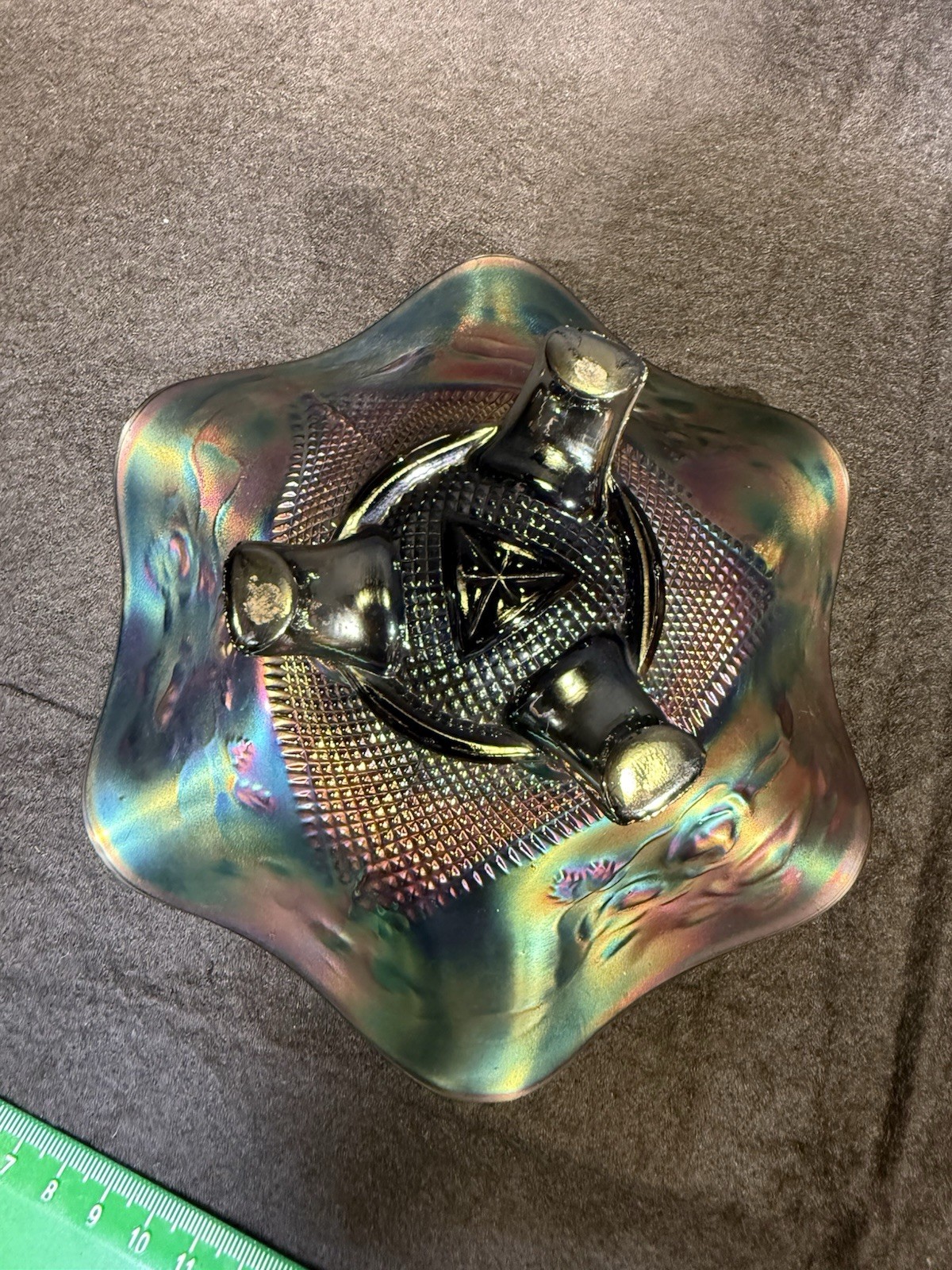 Carnival glass ruffled bowl with three-toed base, likely by Northwood