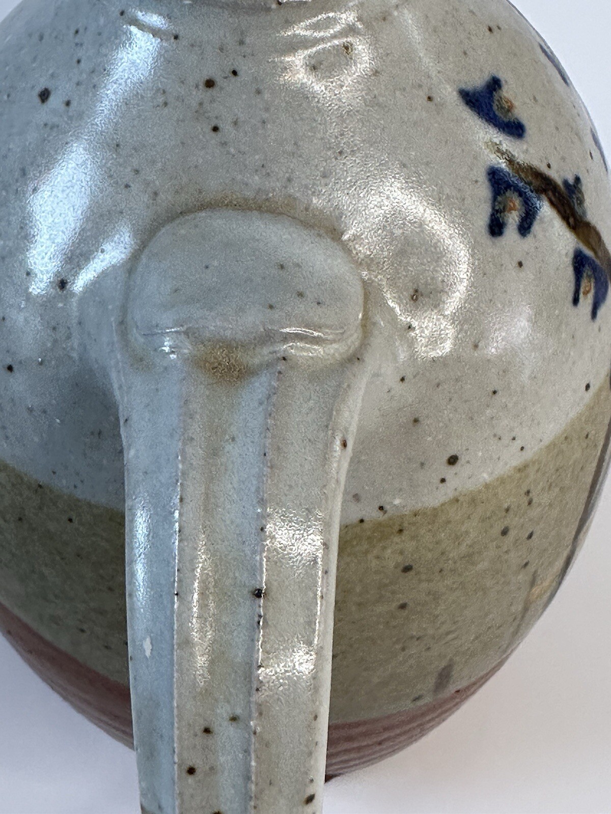 Signed AM stoneware jug, gray, tan, rust, blue, brown. Earthy Natural colors.