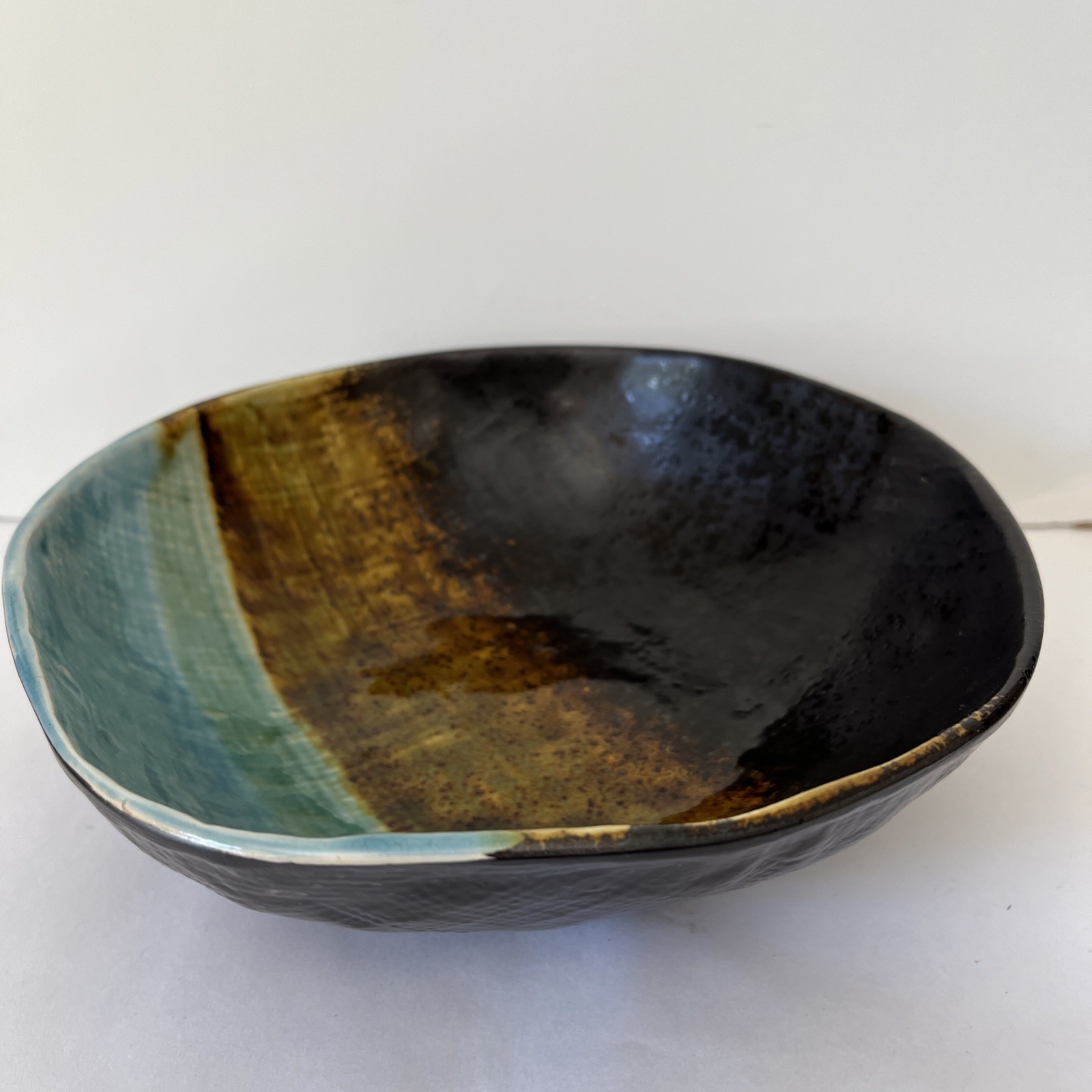 Pier 1 Cassidy asymmetrical bowl -blue and brown crackled, textured glaze