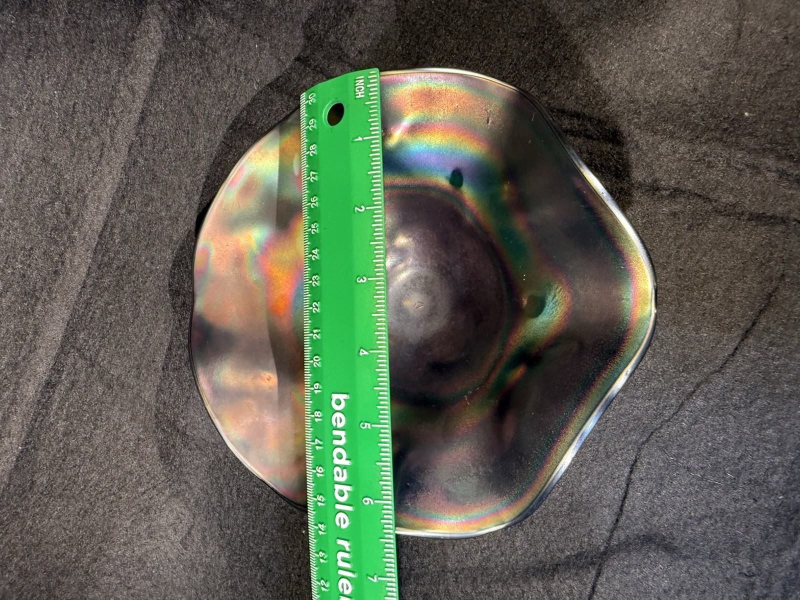 Carnival glass ruffled bowl with three-toed base, likely by Northwood